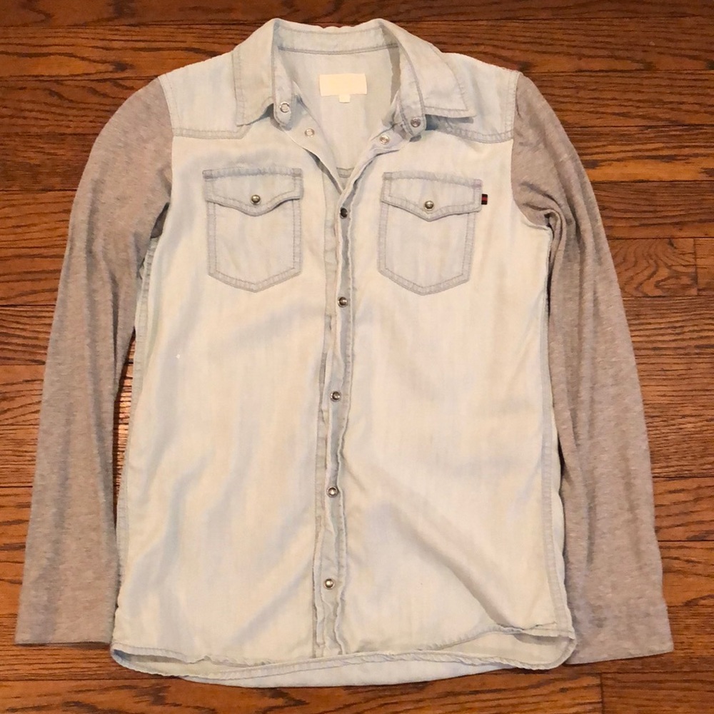 This is a perfectly kept Gucci shirt. it is a size 12 boys denim/cloth button up